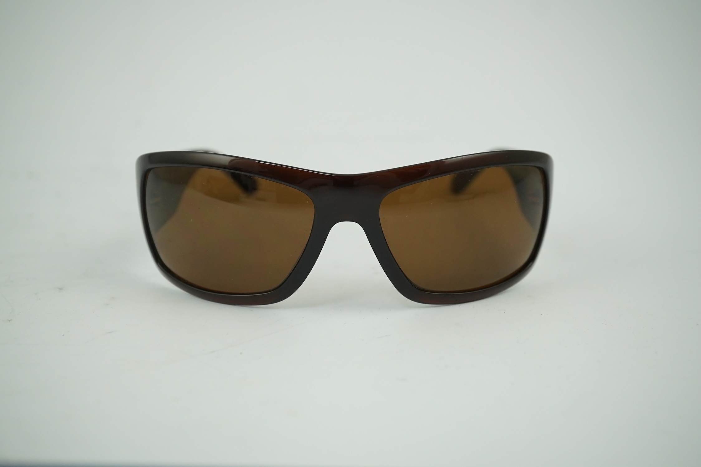 A pair of lady's brown Chanel sunglasses with hard case